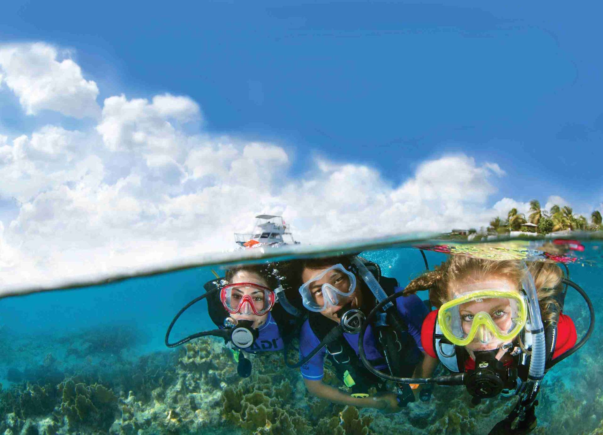 Family learning to scuba dive with a PADI instructor